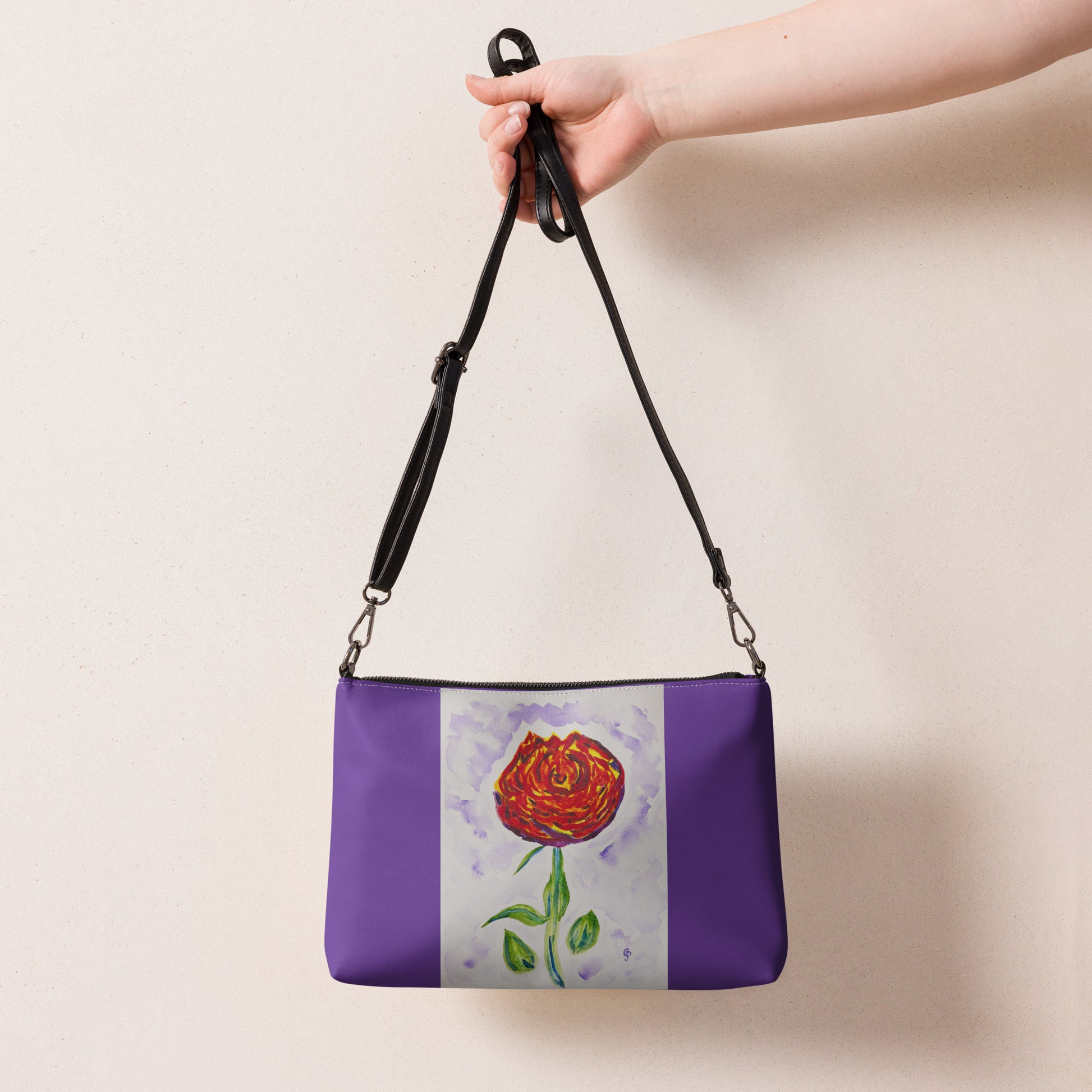 Purple handbag with a red rose design