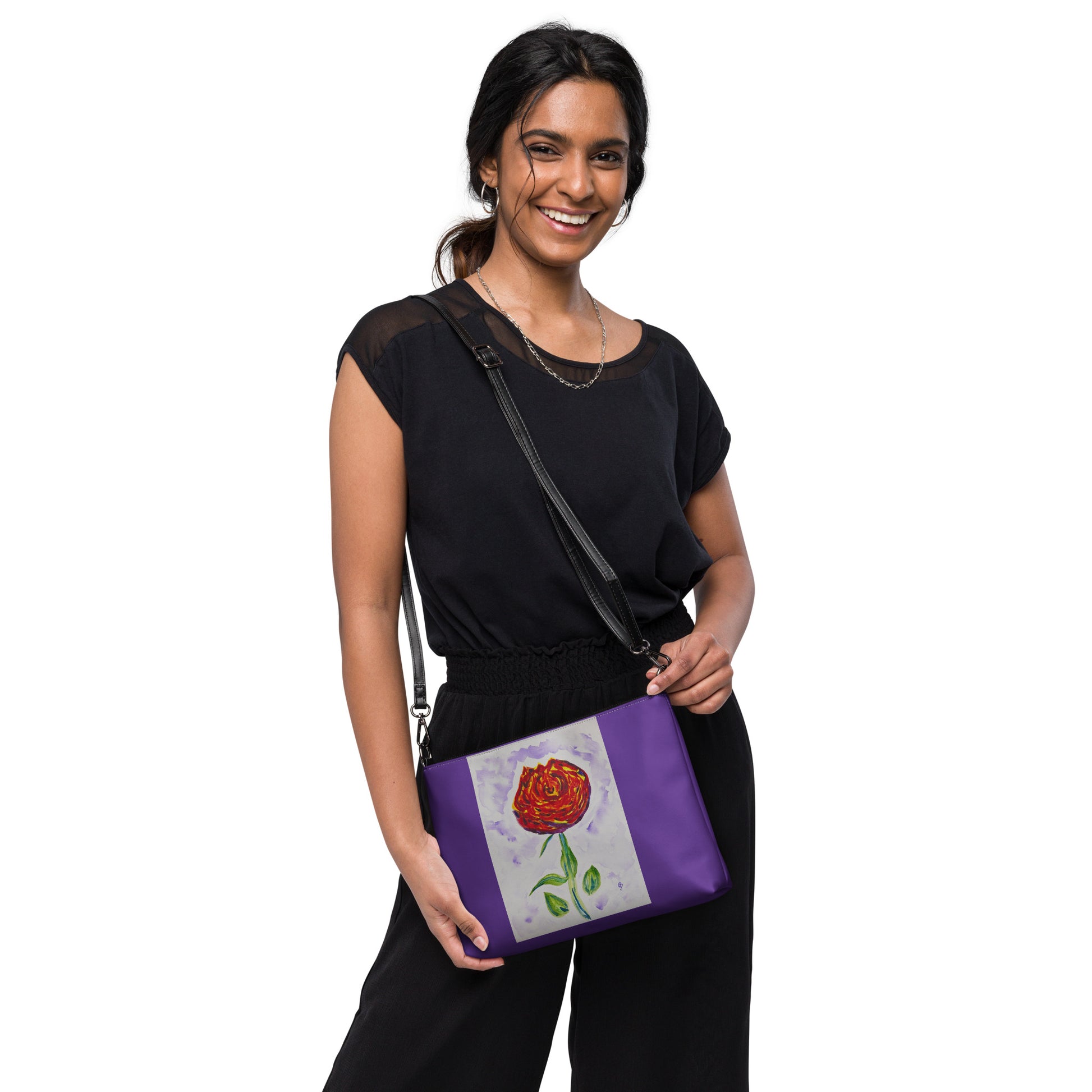 Woman with a crossbody purple bag with a rose design