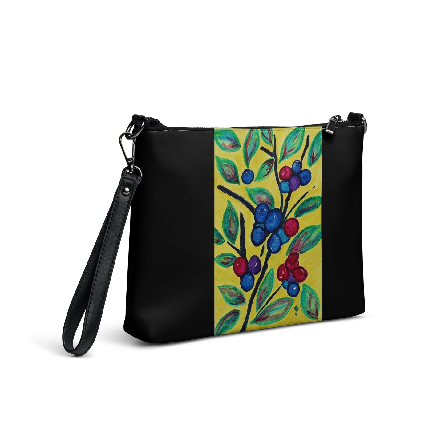 Black handbag with a colorful floral design on a yellow background