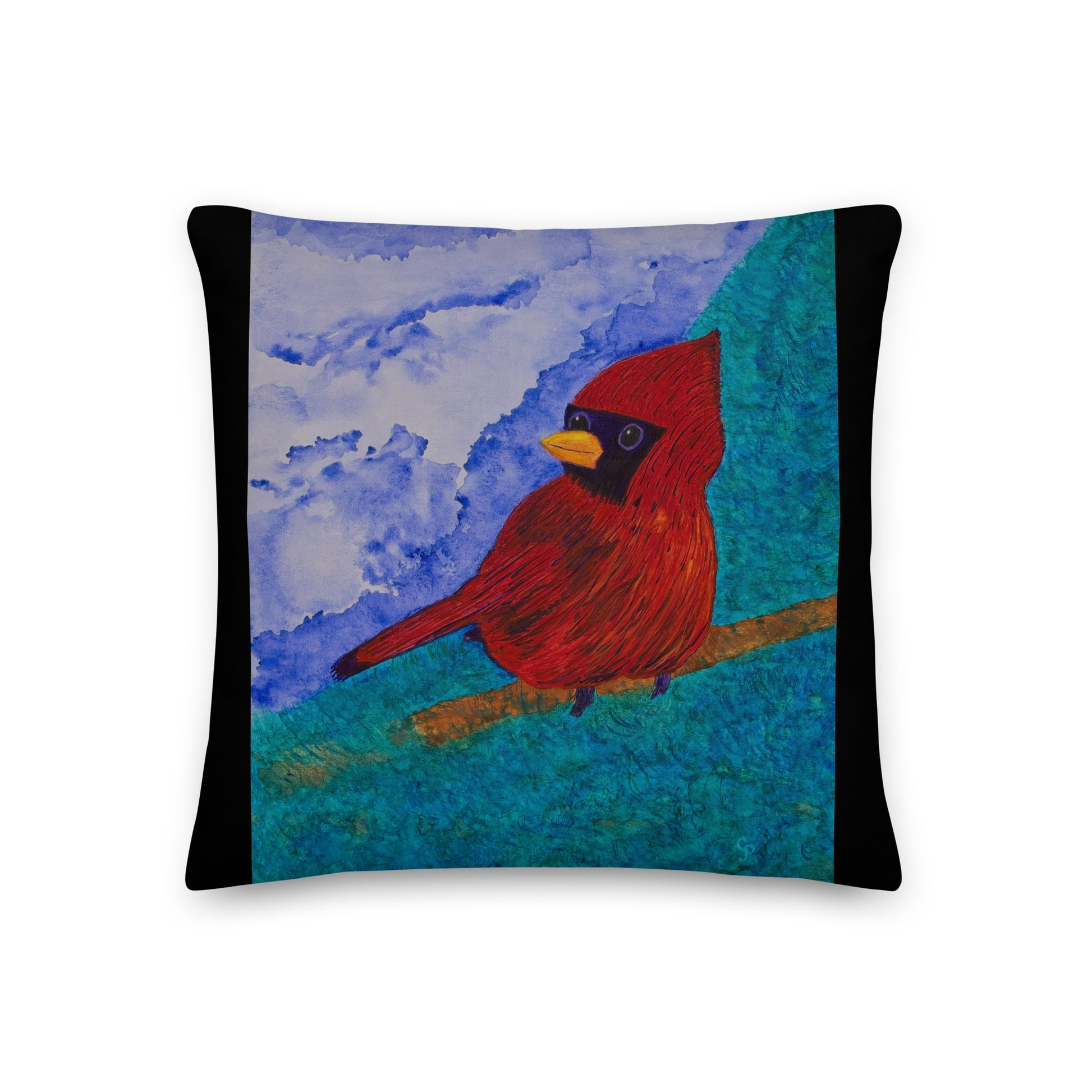 Decorative pillow with a red cardinal bird design on a blue and black background