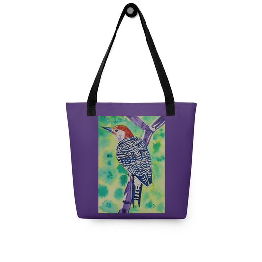 Purple tote bag with a woodpecker bird design