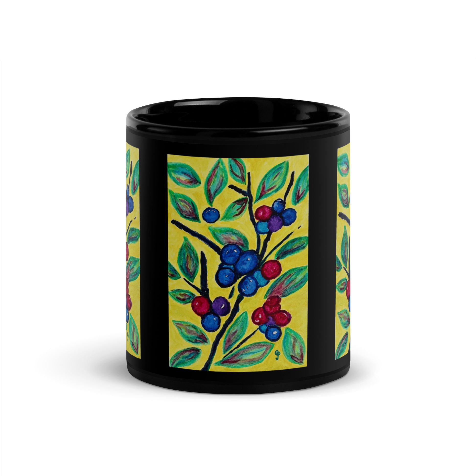 Black mug with colorful berry design on a white background