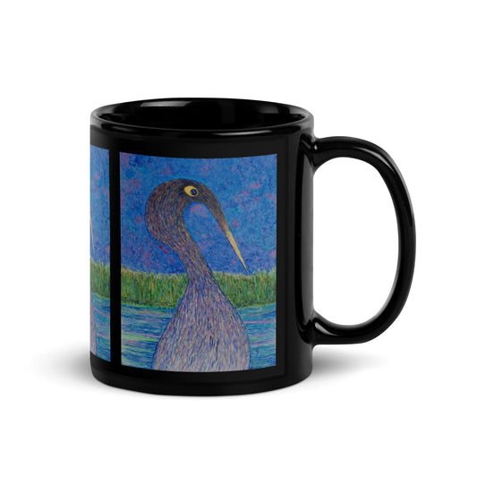 Black mug with a bird on a blue background