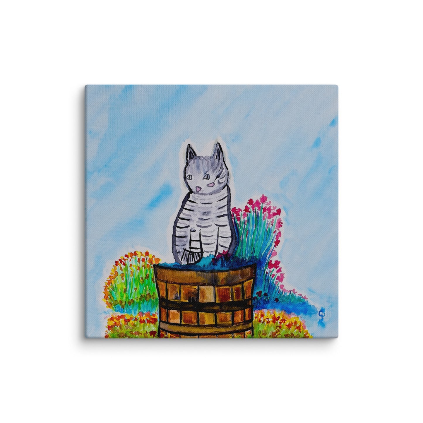 Canvas print of a cat sitting in a barrel with flowers on a blue background
