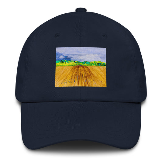 Navy blue cap with a colorful landscape field design on a white background