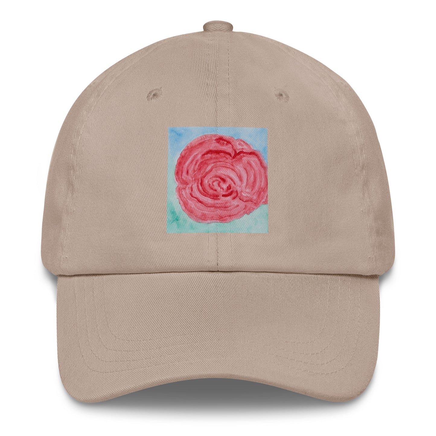 Beige cap with a pink rose design on a blue background