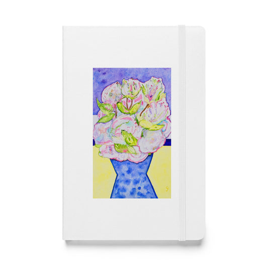 Notebook with floral design on a white background
