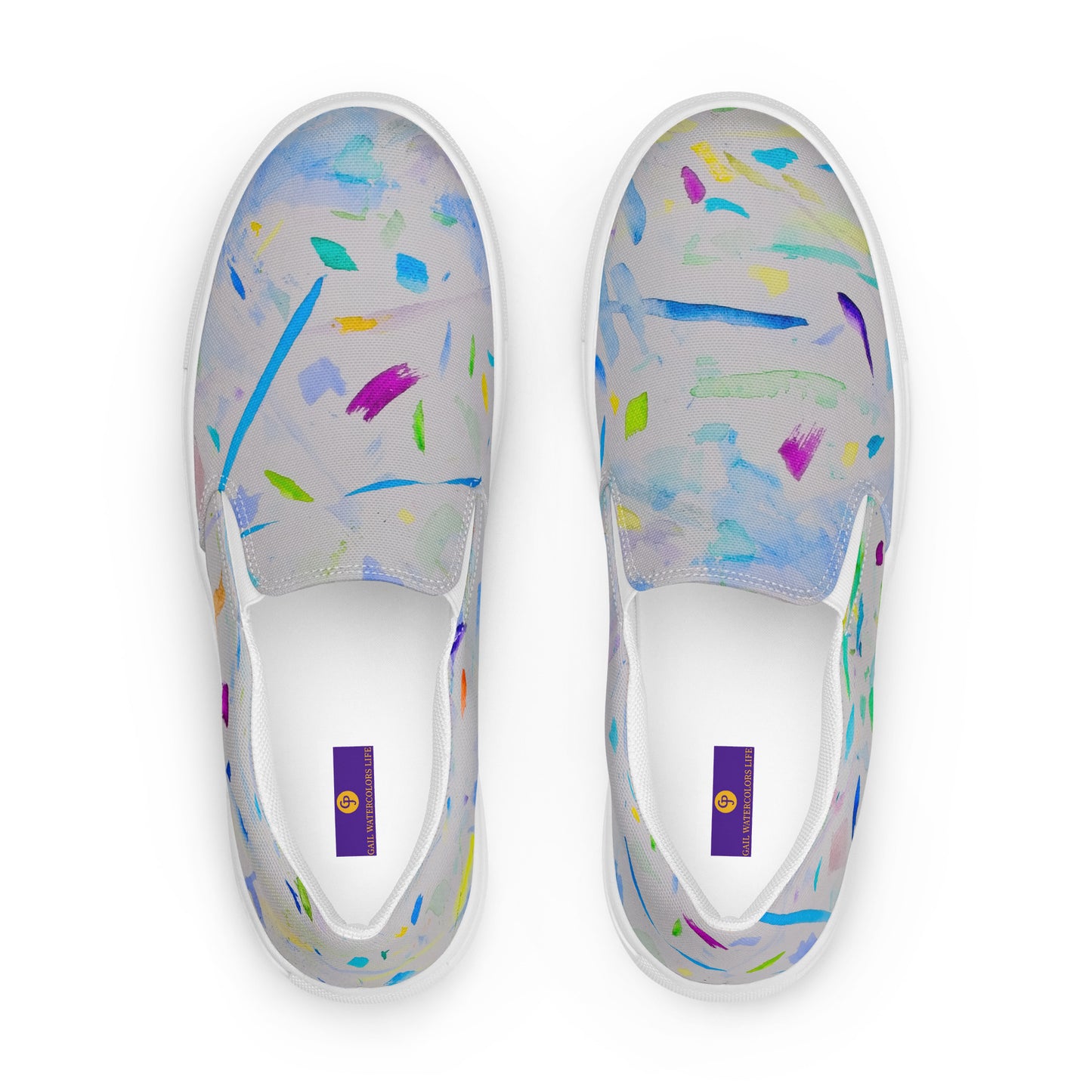 White slip-on shoes with colorful abstract pattern on a white background