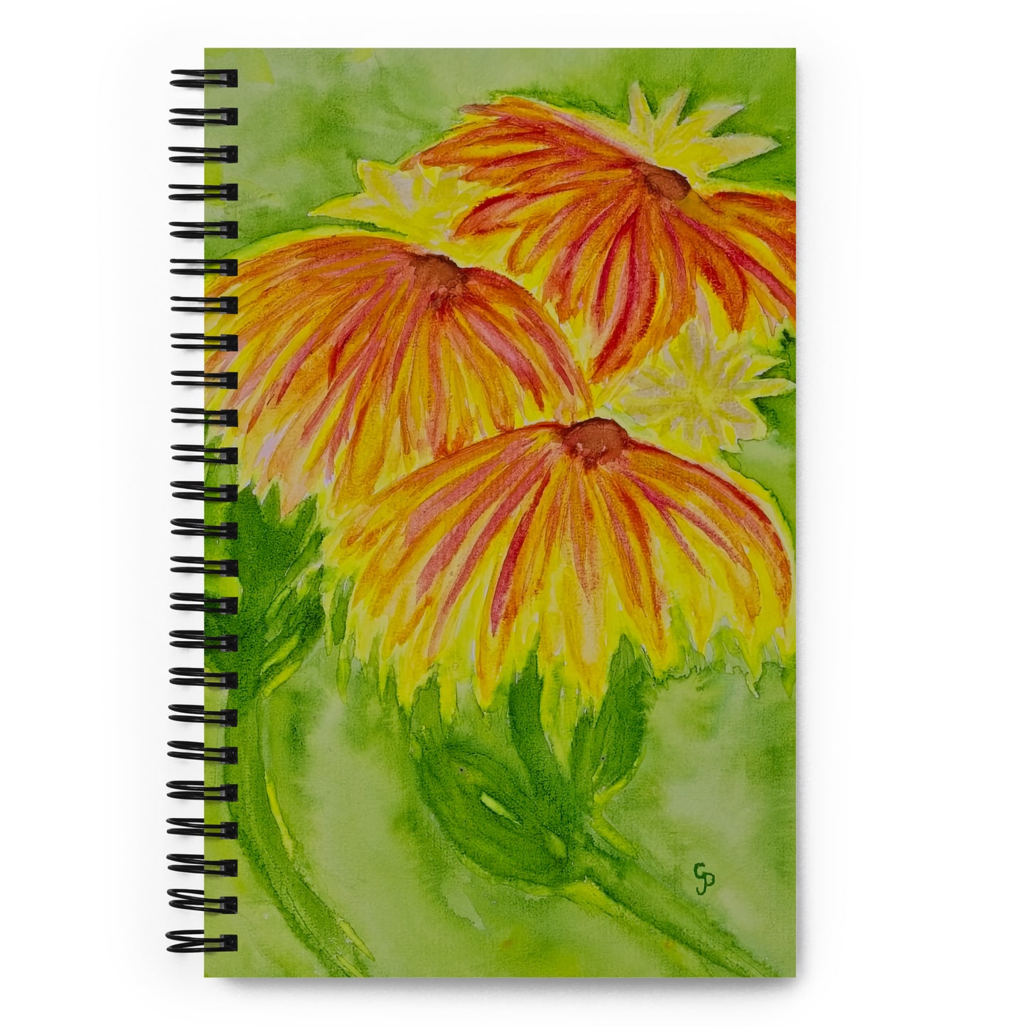 Notebook with a floral design on the cover featuring yellow and orange flowers.
