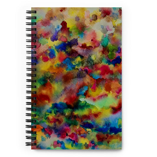 Spiral-bound notebook with a colorful abstract design on a white background