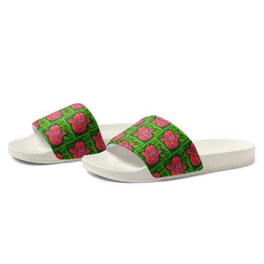White slides with green floral straps on a white background
