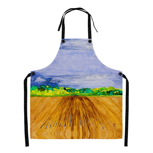 Apron with a painted design of a landscape featuring a blue sky, green trees, and brown field.