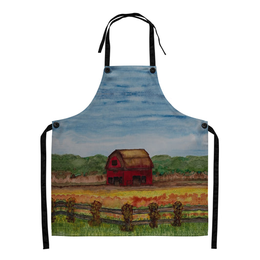 Apron with a painted design of a red barn in a field on a white background