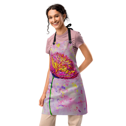 Woman wearing a colorful apron with a floral design on a white background