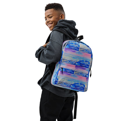 African American boy wearing a colorful backpack with waves on it with a white background