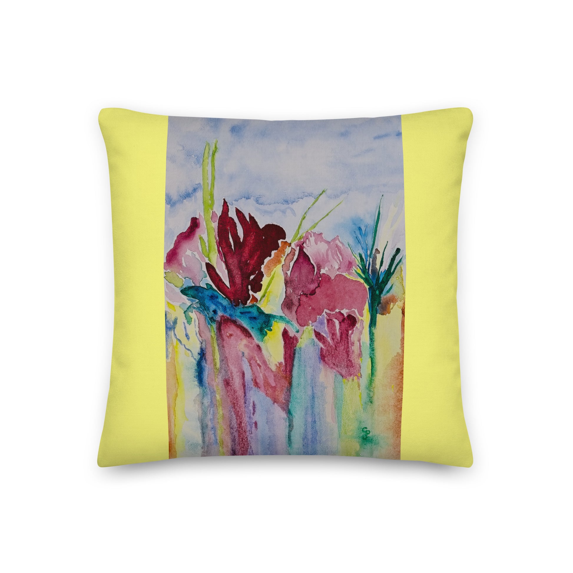 Decorative pillow with floral design on a yellow background