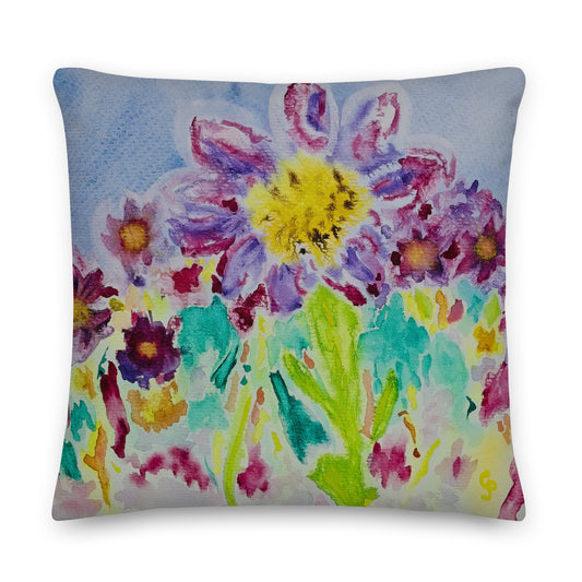Decorative pillow with colorful floral design on a white background