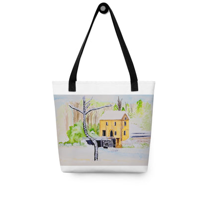 Tote bag with a winter scene featuring a yellow house and trees