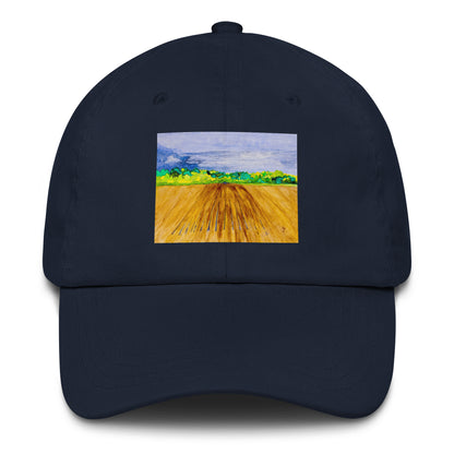 Navy blue cap with a colorful landscape field design on a white background