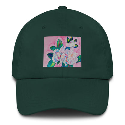 Green cap with a floral design on a pink background