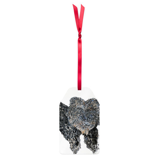 Dog ornament with a red ribbon