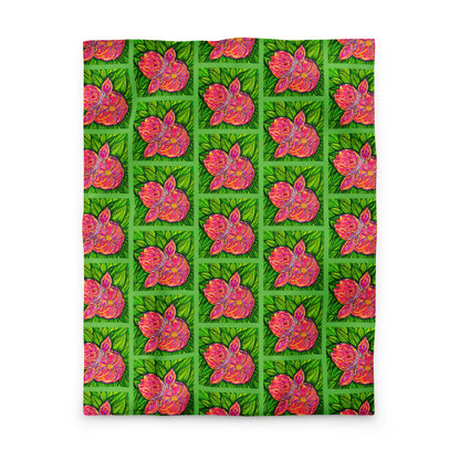 Patterned fabric with pink floral design on a green background