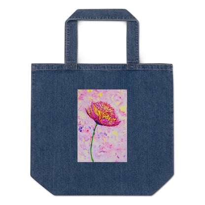 Denim tote bag with a colorful flower design on a white background