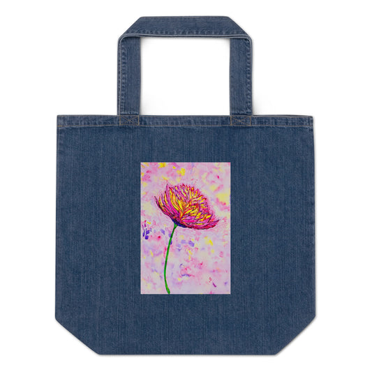 Denim tote bag with a colorful flower design on a white background