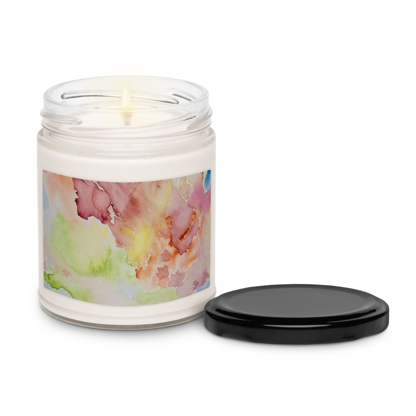 Candle in a glass jar with a floral label on a white background