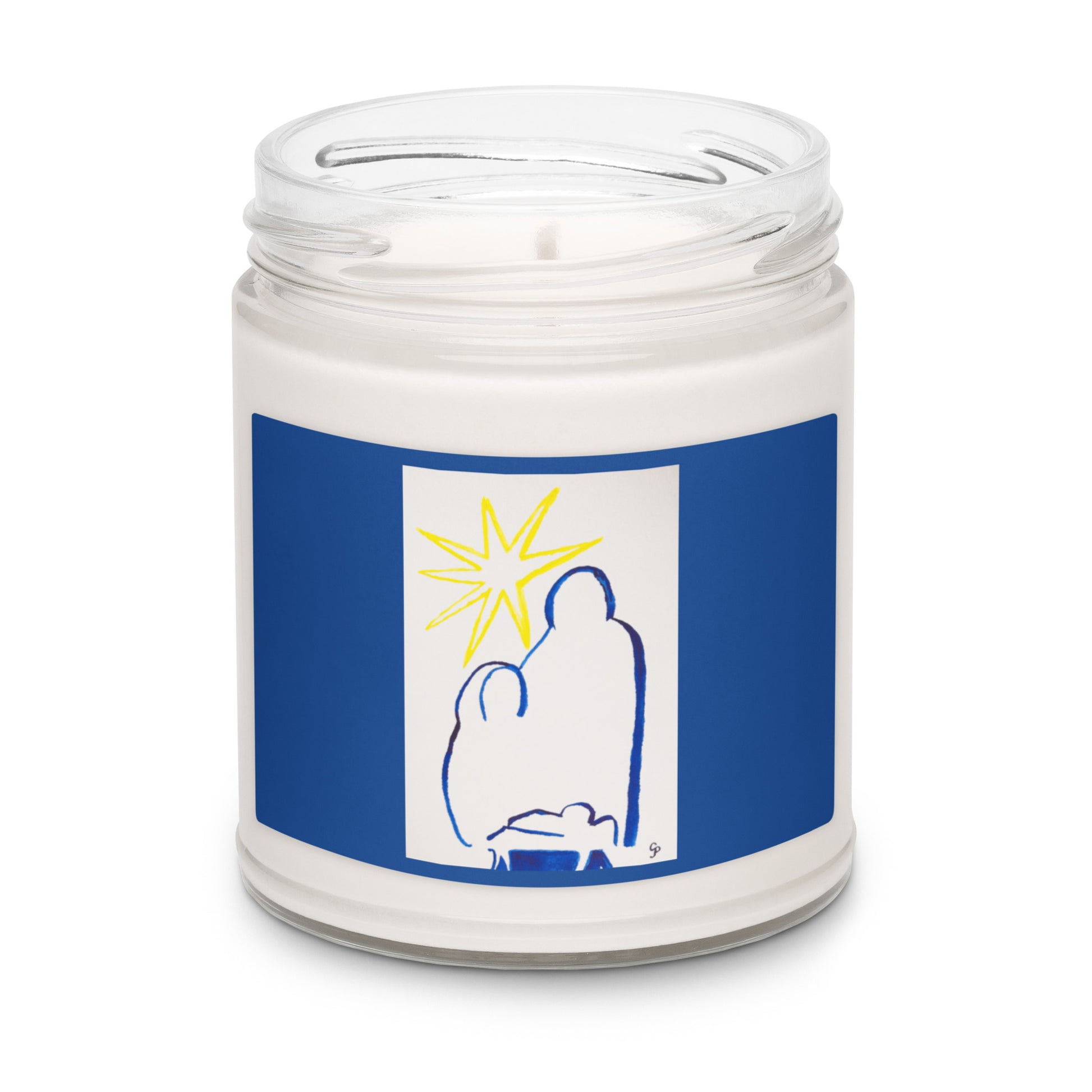 Candle in a jar with a blue label featuring a stylistic outline of the nativity family and the yellow star 
