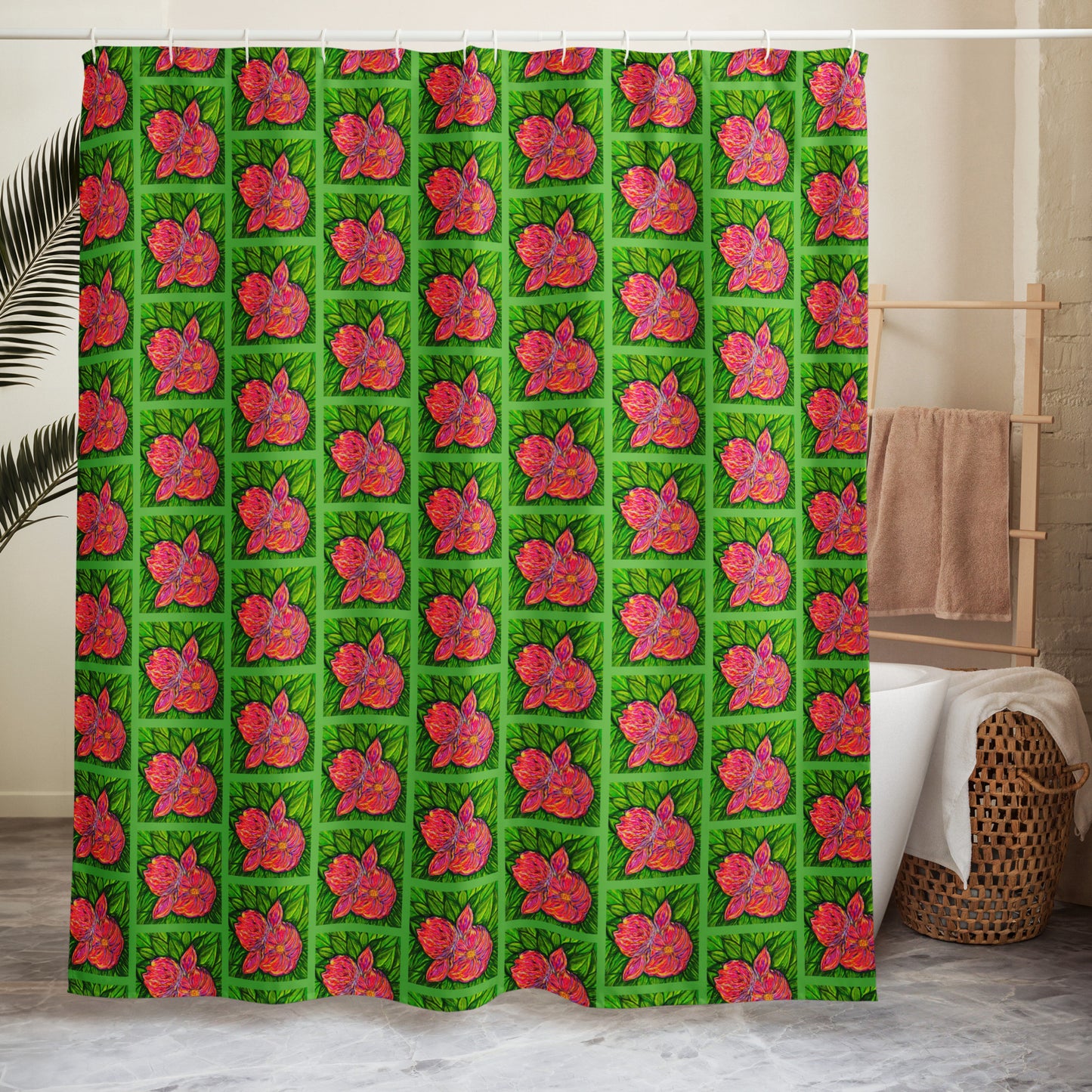 Shower curtain with pink floral pattern on green background in a bathroom setting