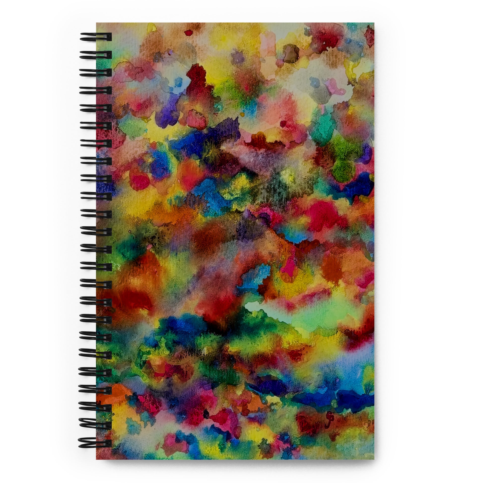Spiral-bound notebook with a colorful abstract design on a white background