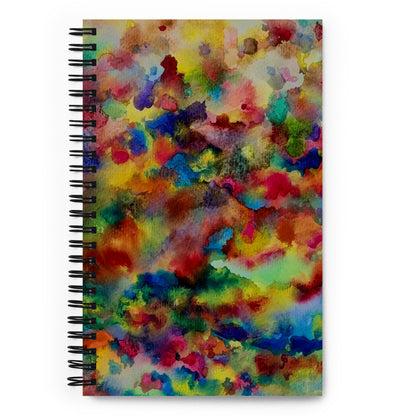 Spiral-bound notebook with a colorful abstract design on a white background