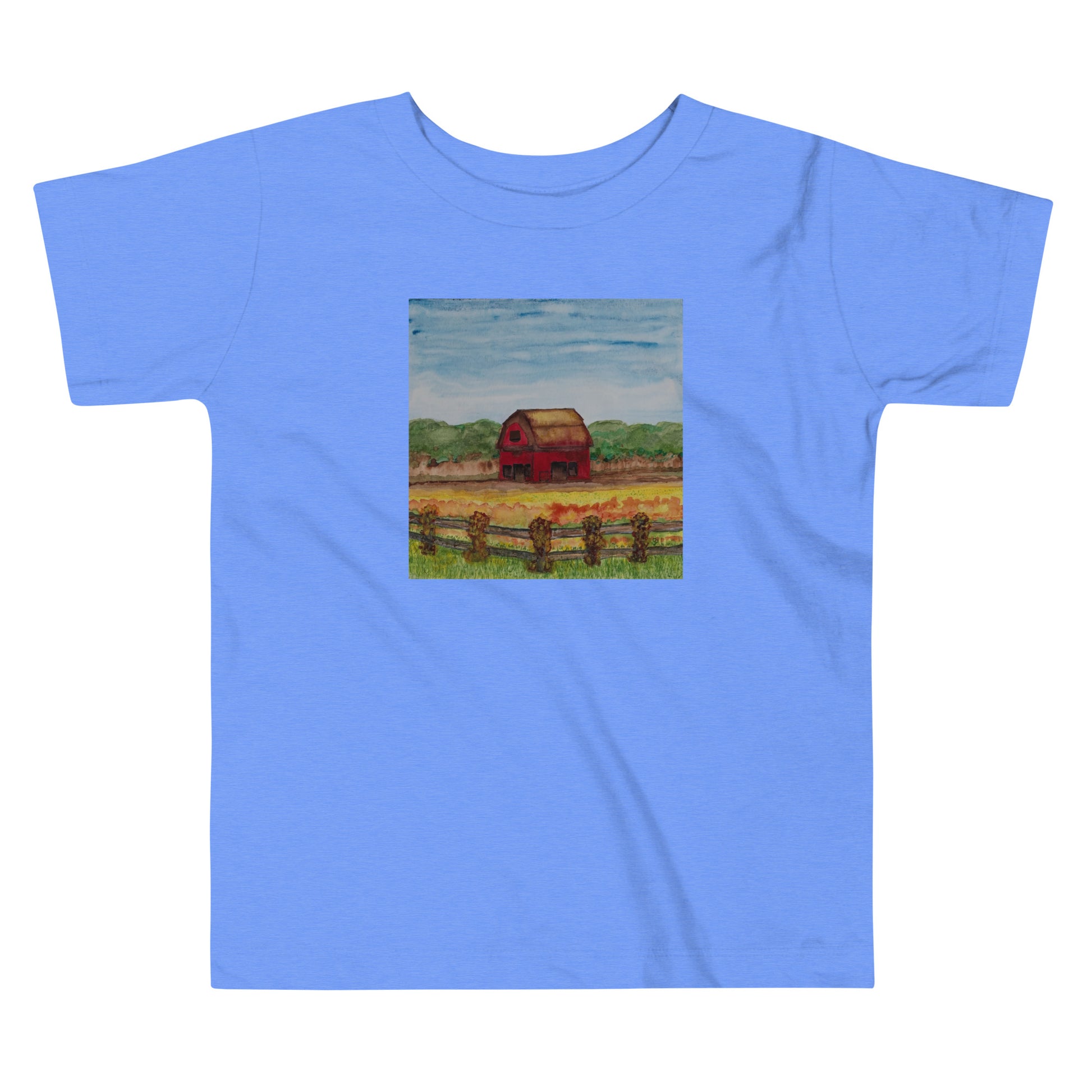 Blue t-shirt with a small square print of a red barn on a white background
