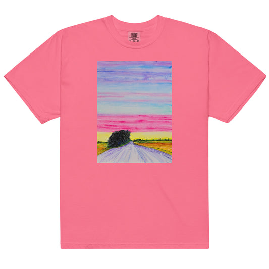 Pink t-shirt with a colorful landscape print on a white background