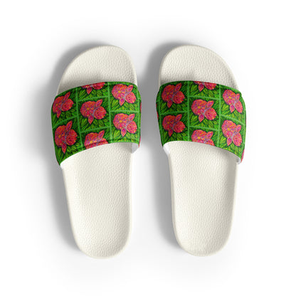 White slides with green floral design on a white background