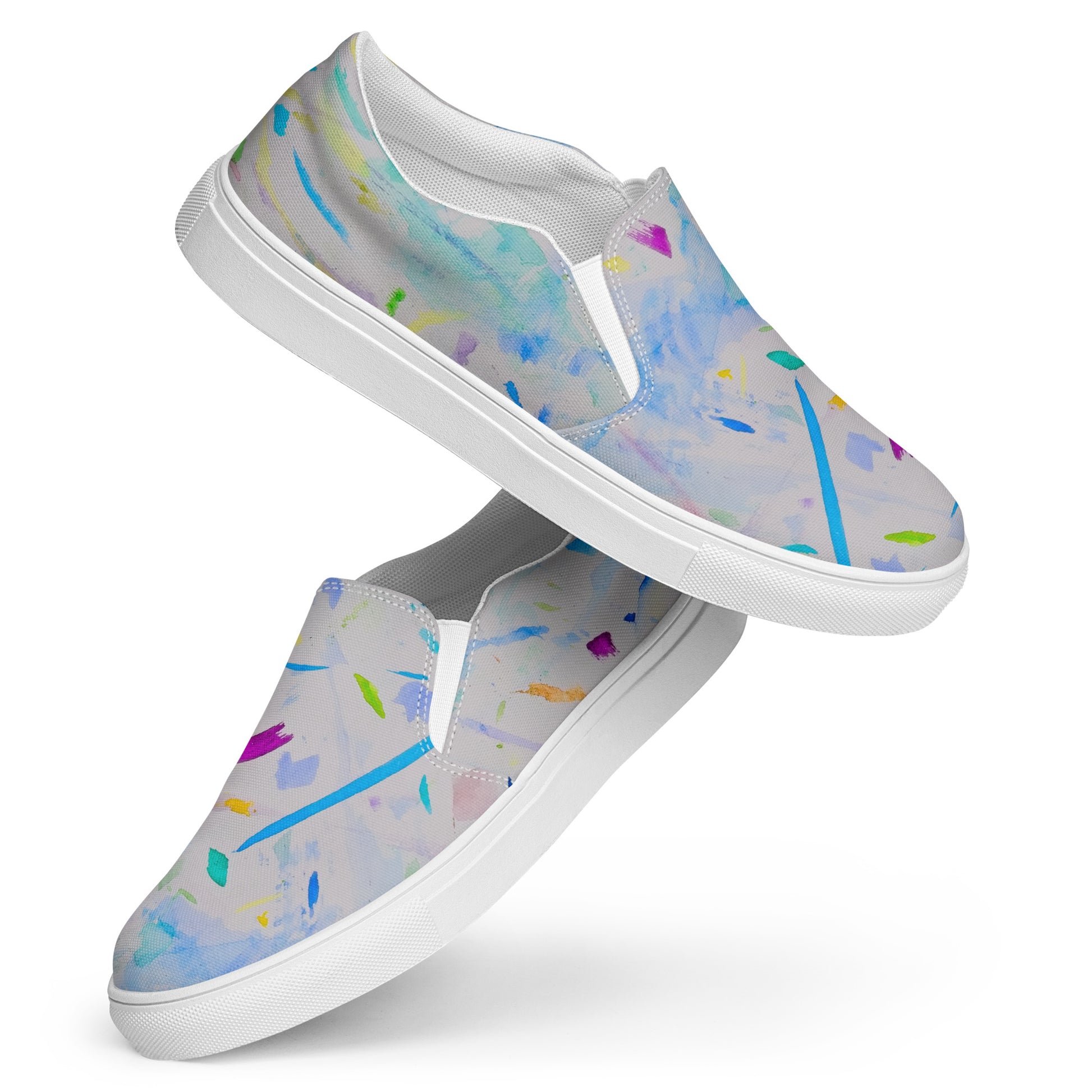 Pair of slip-on shoes with colorful abstract pattern on a white background