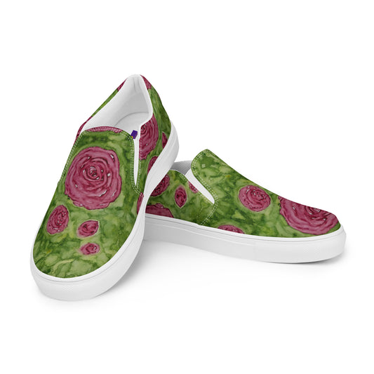 Green slip-on shoes with pink rose pattern on a white background